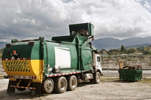 Construction debris being loaded into a grab truck